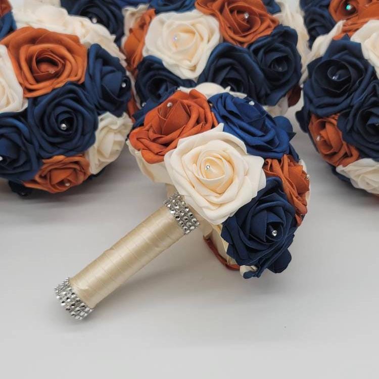 Wedding bouquet Navy, cream, and burnt orange real touch roses.