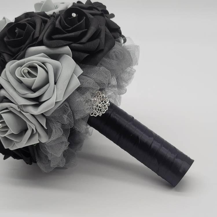 Black satin ribbon handle with silver brooch