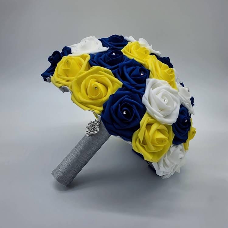 Bridal bouquet in yellow, blue, and white