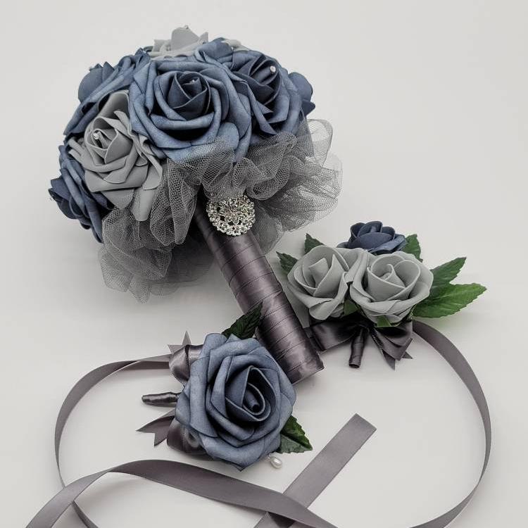 Dusty blue and gray bouquet with boutonniere and wrist corsage