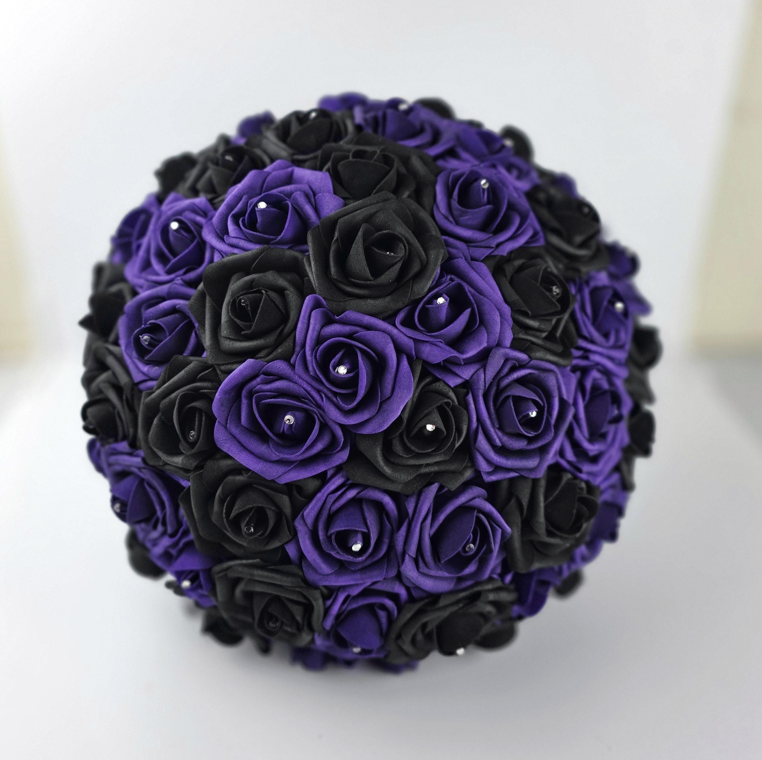 A black and dark purple bouquet made with Real Touch roses with a rhinestone in the center of every rose.