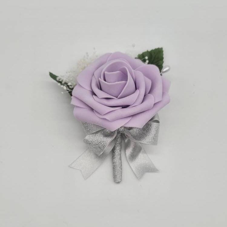 Lilac rose boutonniere with silver ribbon with baby's breath