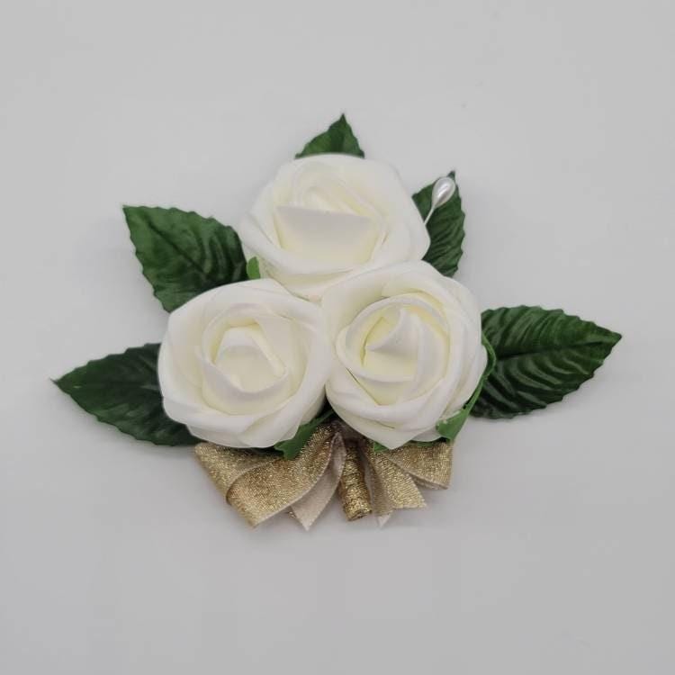 Ivory pin on corsage with gold ribbon made from Real Touch Roses
