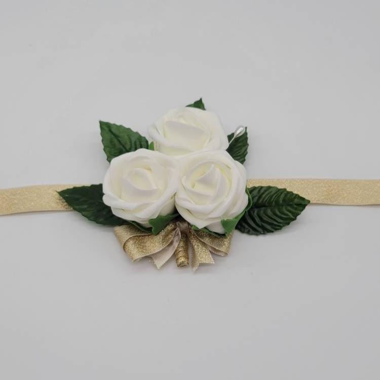 Ivory wrist corsage with 5 faux leaves