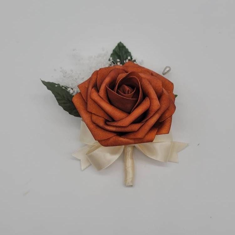 Burnt Orange Boutonniere with Ivory ribbon and baby's breath