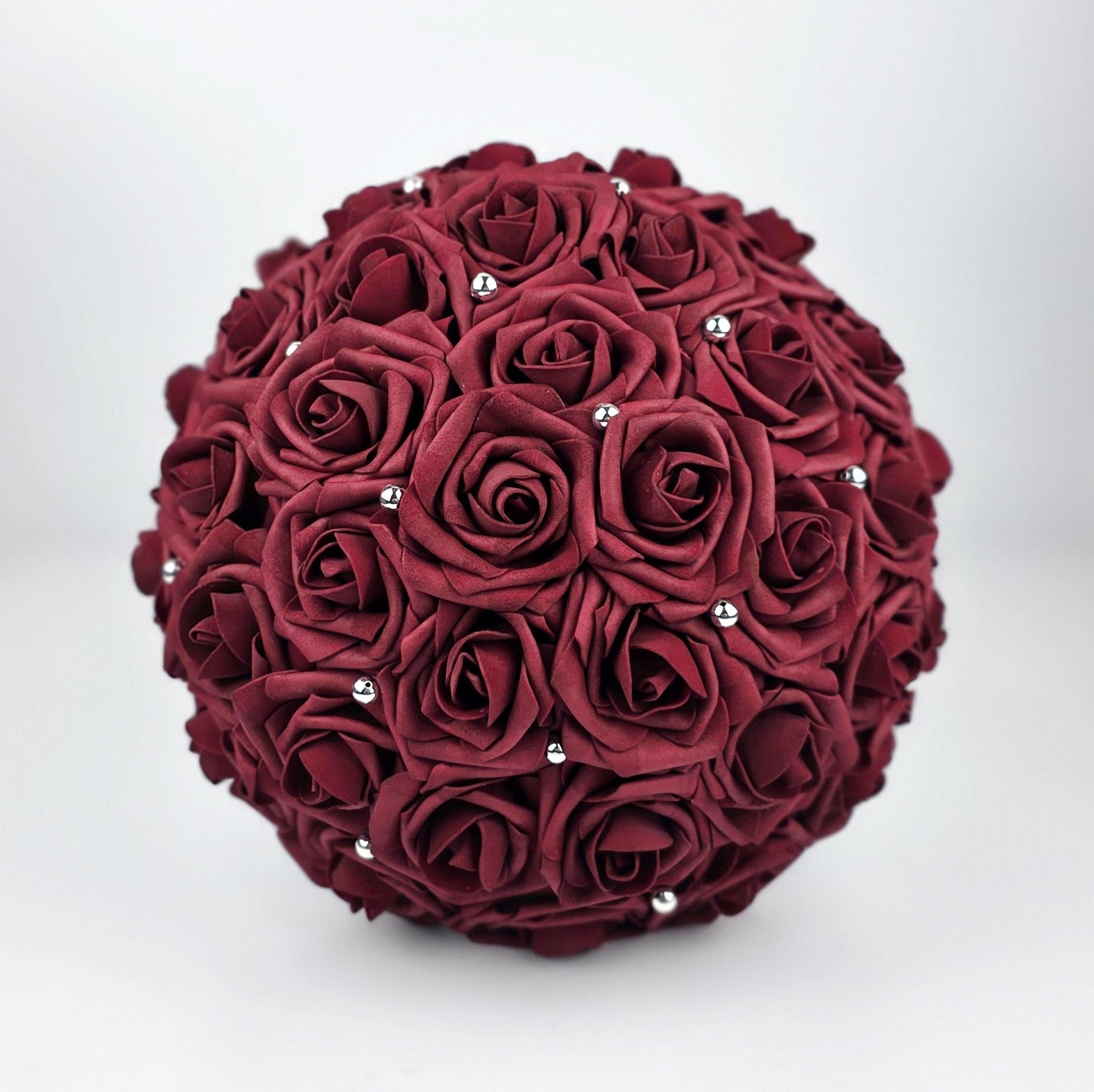 Front of bouquet- burgundy roses with scattered silver balls