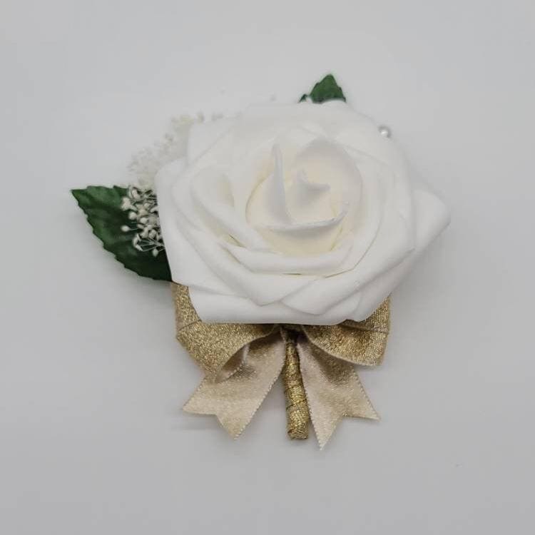 Ivory boutonniere with gold ribbon and baby's breath