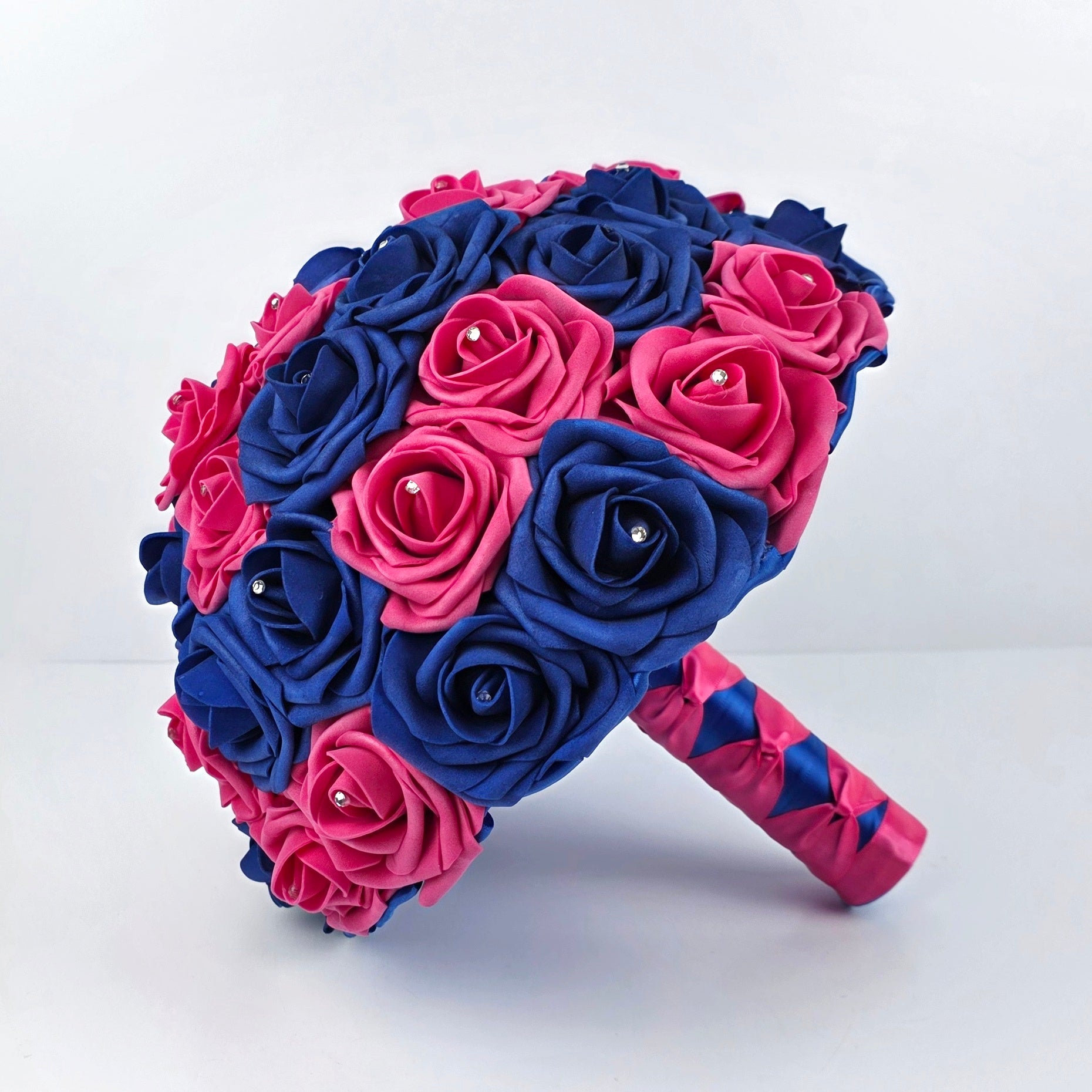 Hot pink and royal blue 10 inch bouquet with hot pink and royal blue ribbon. 